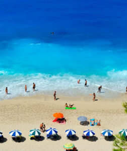 swimming around sandy blue indian ocean at Mombasa Kenya beach holiday